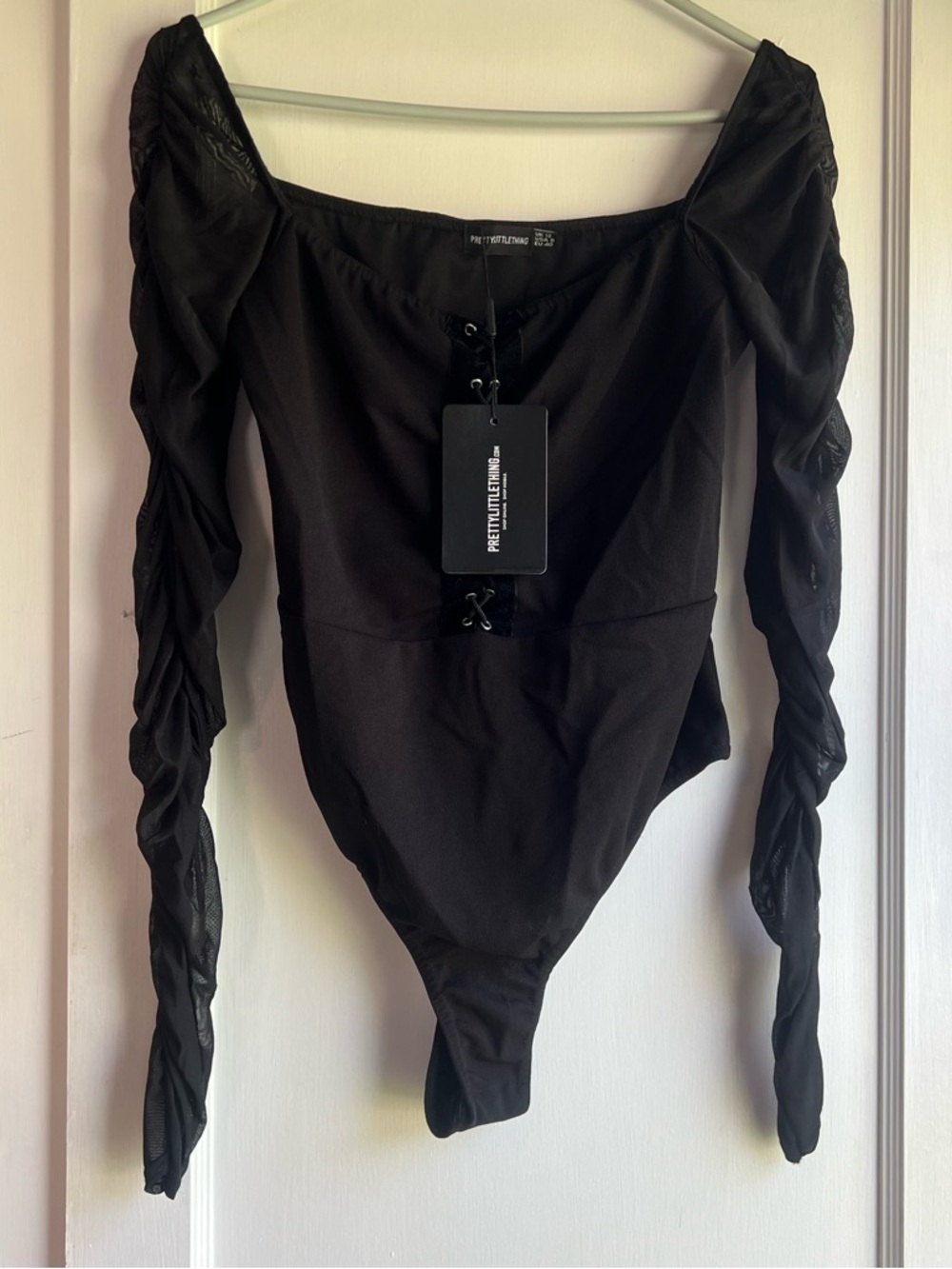 Pretty Little Things Black Lace-Up Long Sleeve Bodysuit